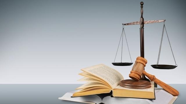 Law school textbooks with gavel and scales