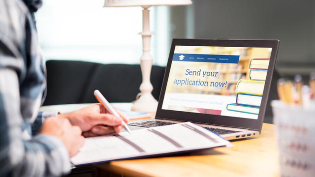 Student writing law school applications