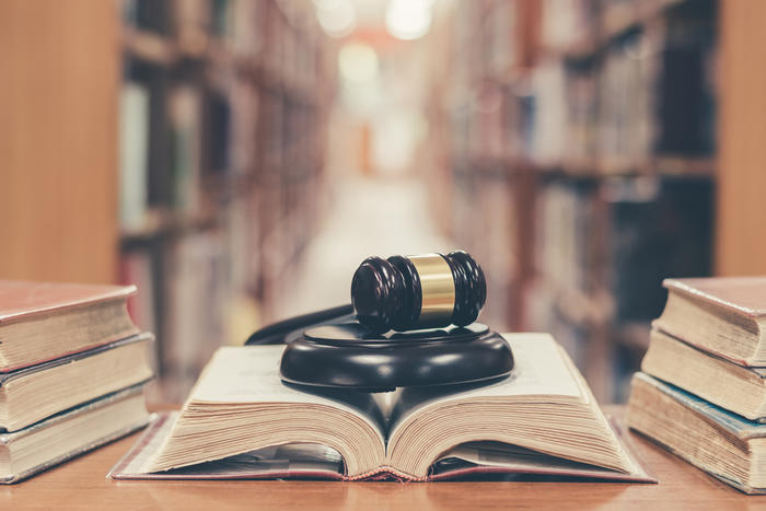 Gavel in a library on top of a book