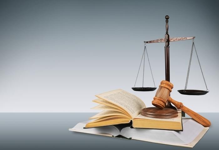 Law school textbooks with gavel and scales
