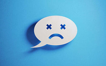 Frowning face in a speech bubble