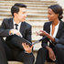 Attorney and lawyer sitting on courthouse stairs